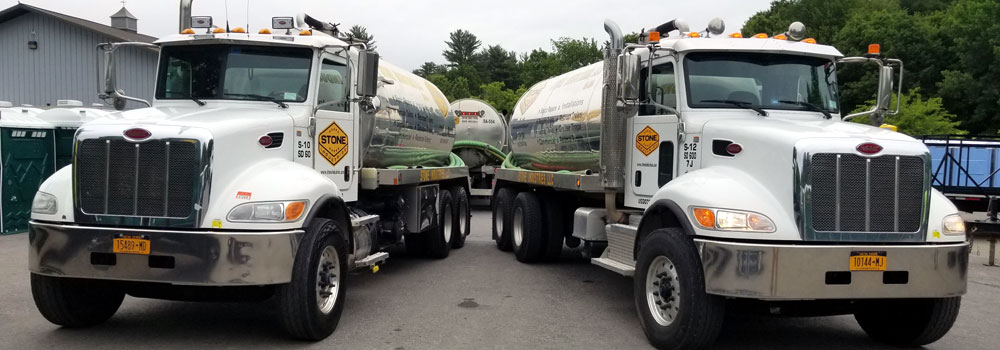 Two of Stone's septic pump trucks getting ready to head off to pump and clean septic tanks. 