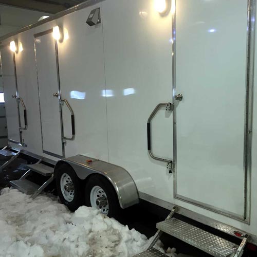 Exterior view in winter of Stone shower/restroom trailer