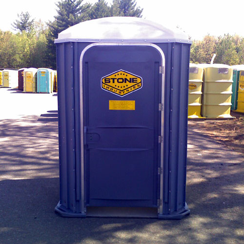 Stone handicapped accessible toilets in our yard