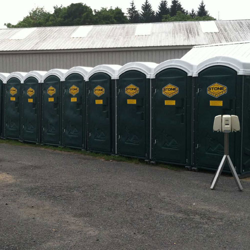 A row of portable toilets lined up for an event